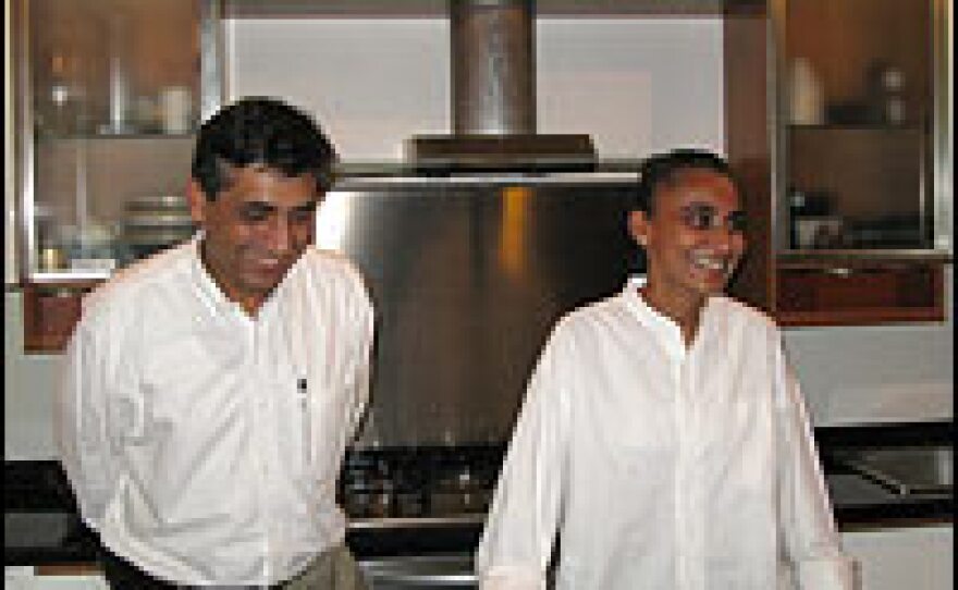 Mahboob Khan and her husband, Adnan Asdar, seen in their kitchen, have benefited from the rapid development in Karachi. Khan is an architect and Asdar is a project manager who does work on large developments.