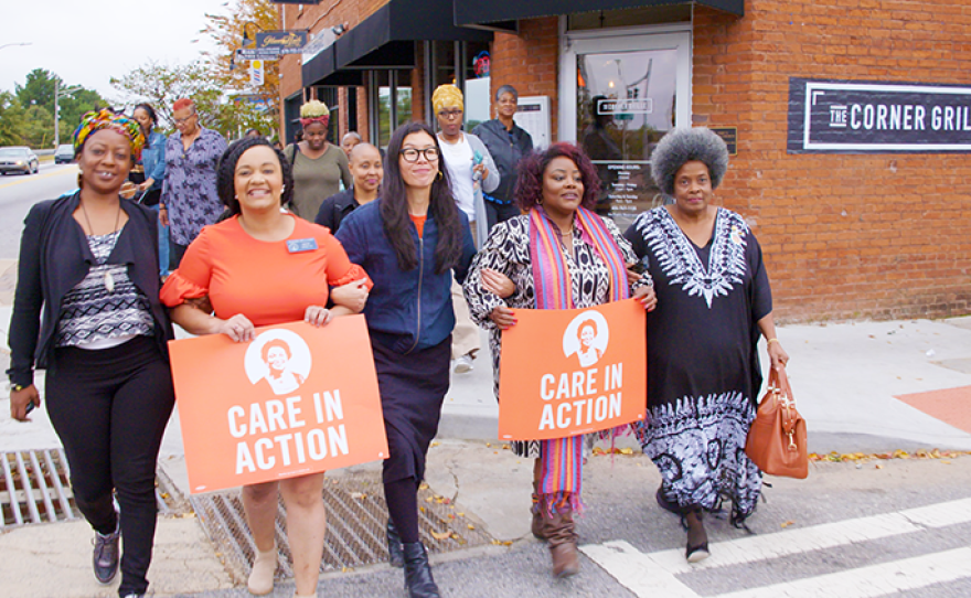 Members of Care in Action, a nonprofit, nonpartisan group dedicated to fighting for dignity and fairness for the millions of domestic workers in the United States, march in support of Georgia gubernatorial candidate Stacey Abrams.