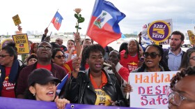 People chant during a rally in Fort Lauderdale, Fla., in support of the extension of Temporary Protected Status (TPS) for Haitian immigrants.