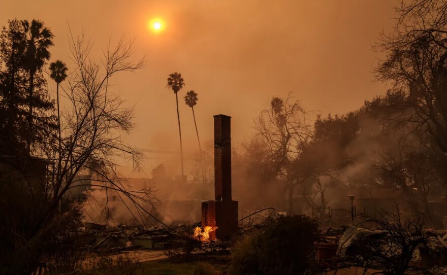 A fireplace remains standing from a home that was burned down by the Eaton Fire in the Altadena and Pasadena area on Jan. 8, 2025.