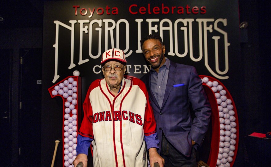 Negro Leagues baseball veteran Jim Robinson, left, and ESPN/ABC correspondent Ryan Smith, seen in New York in February.