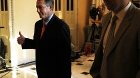 House Speaker John Boehner gives a thumbs up after the chamber passed his plan Friday to raise the debt ceiling and cut spending. The Senate voted to kill the measure a short time later.