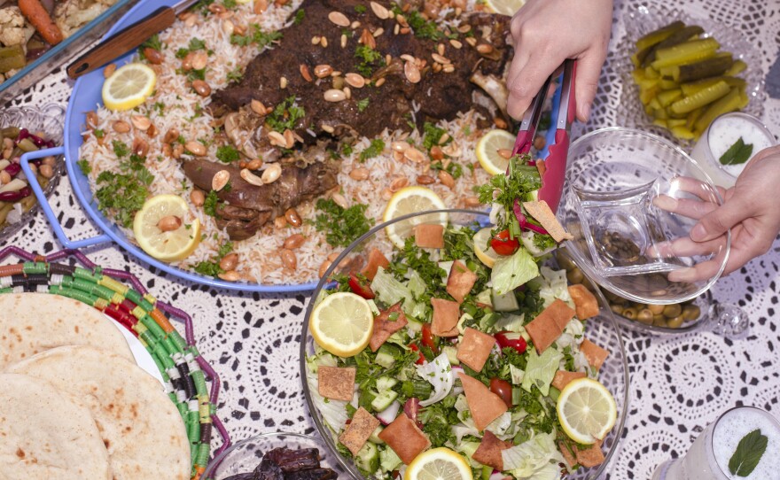 For iftar, the fast-breaking meal after sunset during Ramadan, a mixture of traditional and nontraditional Arabic foods, including lamb served with rice and a side of fattoush, an Arabic salad topped with fried pita bits.