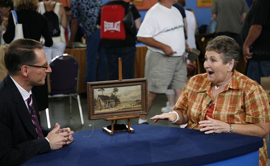David Weiss (left) appraises a William Aiken Walker oil painting, ca. 1880, in Louisville, Ky. ANTIQUES ROADSHOW “Vintage Louisville 2021, Hour 2” premieres Monday, March 29 at 8/7C p.m. on PBS.