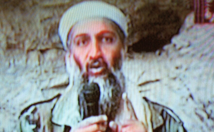 Osama bin Laden is seen at an undisclosed location in a television image broadcast Oct. 7, 2001.