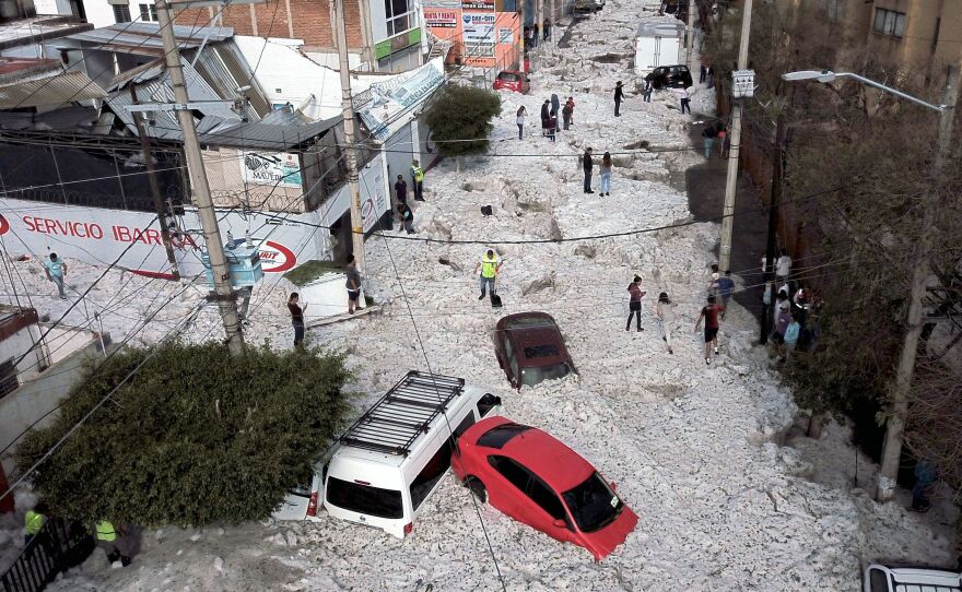Vehicles were buried in hail on Sunday in eastern Guadalajara, Jalisco state, Mexico. The accumulation of hail buried vehicles and damaged homes.