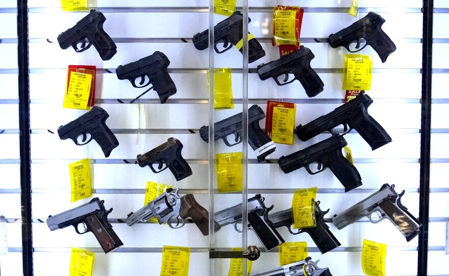 A study estimates that 32 million children live in homes with firearms, and a significant portion of those guns are not stored safely. Here, handguns are displayed at Kittery Trading Post, in Kittery, Maine.