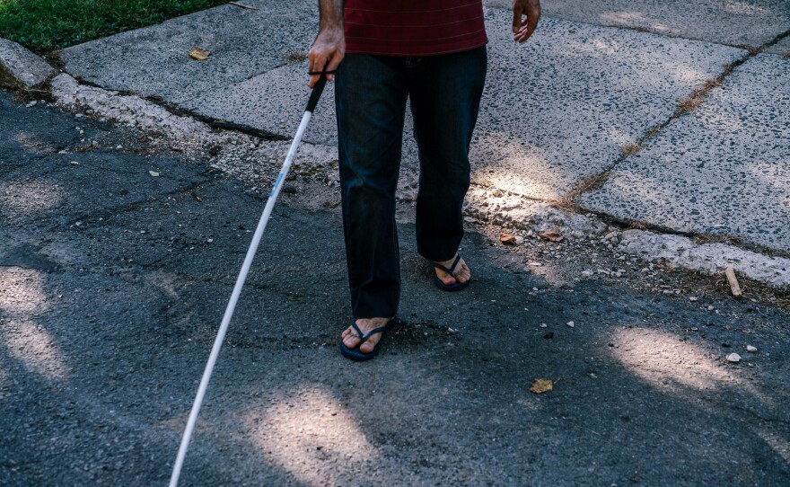 Osama walks outside after his and his wife's English class. He was blinded in a military attack on his uncle's home in a Damascus suburb in 2012.