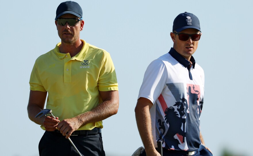 Justin Rose of Great Britain (right) edged Henrik Stenson of Sweden on the 18th hole to win a gold medal in Olympic golf Sunday. The match was played at the Olympic Golf Course in Rio de Janeiro.