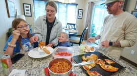 Amber and Neil Petersen serve lunch to two of their children, 11-year-old Eden and 4-year-old Jack, while visiting Amber's parents in Iowa City, Iowa.