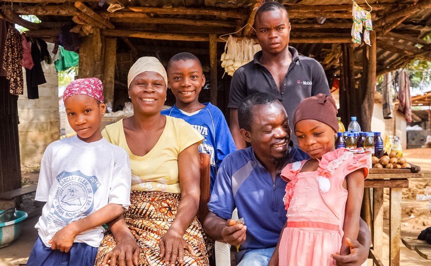 They're a family of survivors (from left): Ramatu Shellu, 8; Bindu Shellu, 44; Luqman Shellu, 10; Hassan Shellu, 22; Reuben Shellu, 43; and Kadija Shellu, 7, pose at their family home in Monrovia. Not pictured: Sekou Shellu, 24, who was working out of town when this picture was taken.