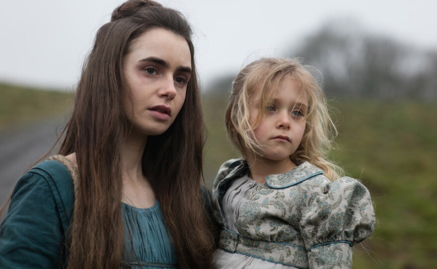 Fantine (LILY COLLINS) and Cosette (MAILOW DEFOY)