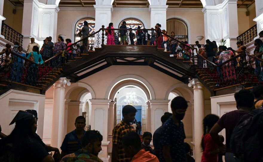 People visit Sri Lankan President Gotabaya Rajapaksa's official residence in Colombo on July 12, 2022, after it was overrun by anti-government protesters on July 9.