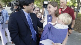 Sen. Richard Pan, D-Sacramento, is thanked by Leah Russin, holding her son Leo, 21 months, after Pan's measure requiring nearly all California school children to be vaccinated in response to a measles outbreak in Disneyland last year, was signed by Gov. Jerry Brown, June 30, 2015.