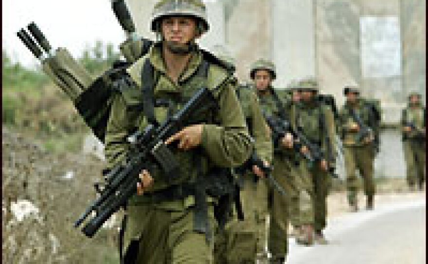 Israeli soldiers patrol the border with Lebanon, close to the northern Israeli village of Shtula.