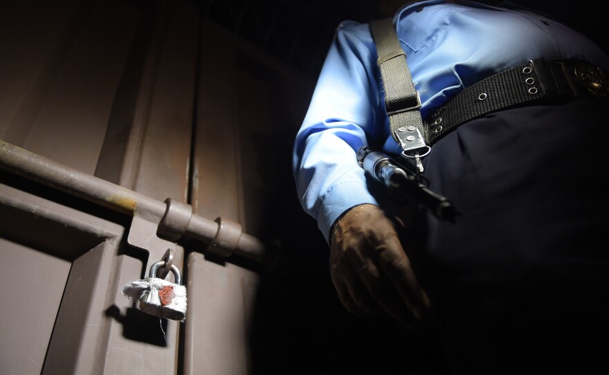 The latest Pakistani crackdown on aid groups isn't the first. Above: A policeman stands guard outside the office of Save the Children in Islamabad, which was shuttered by Pakistani authorities in June 2015 under suspicion of "working against the country," according to government officials.