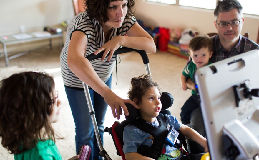 Gideon, 3, communicates with his parents Kathleen Muldoon and Seth Dobson, his sister Genevieve and brother Cormac, using an electronic device they call, "Gideon's talker."