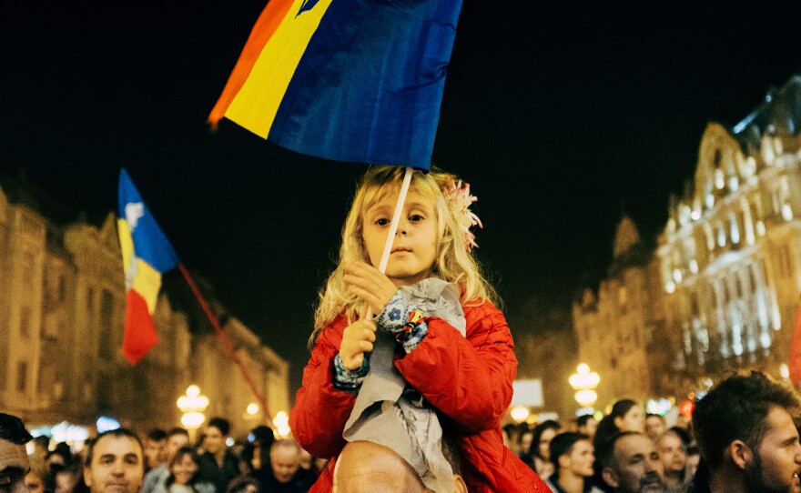 A young girl waves the Romanian flage at a recent anti-corruption rally in Timisoara, Romania.