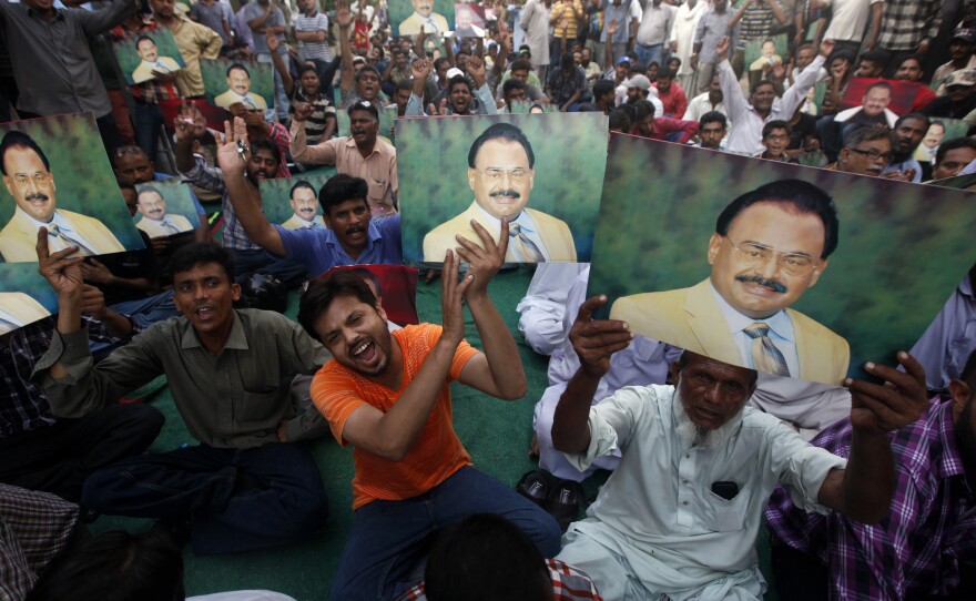 Thousands of supporters of Altaf Hussain began a sit-in in Karachi on Tuesday shortly after he was detained in London for questioning on suspicion of money laundering.