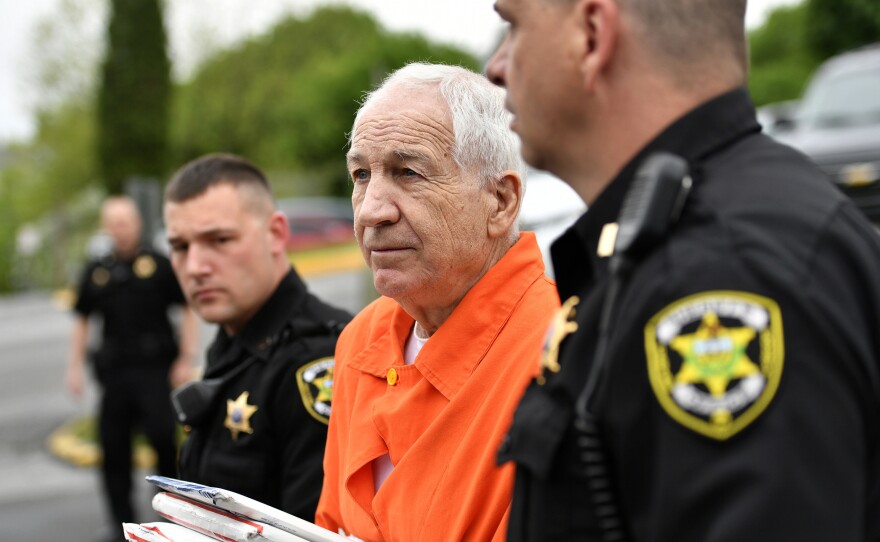 Jerry Sandusky enters the Centre County Courthouse for a hearing on May 2 in Bellefonte, Pa. Sandusky has filed a petition under Pennsylvania's Post Conviction Relief Act, seeking a new trial. Meanwhile, civil cases between various parties are uncovering new details of allegations against Sandusky — including some that predate by decades the crimes of which he was convicted.
