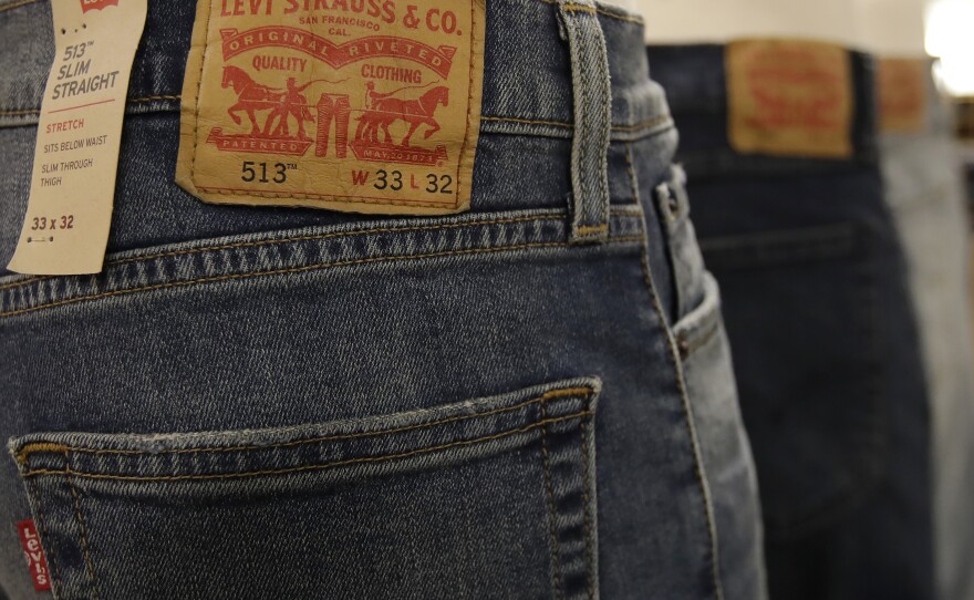 Contemporary Levi's jeans are displayed at a Kohl's store. A pocket on an 1880s-era pair of Levi's recently sold at auction says, "The only kind made by white labor."