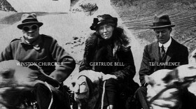 Gertrude Bell on camel between W. Churchill and T.E. Lawrence. Photographed at the Cairo Conference in 1921. 