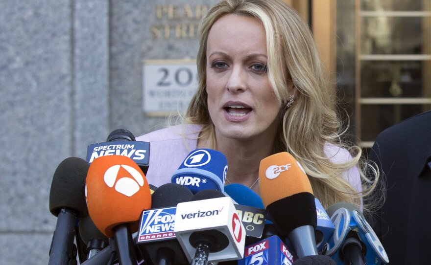 Adult film actress Stormy Daniels speaks outside federal court in New York in April 2018. She is testifying this week in the criminal trial of former President Donald Trump.