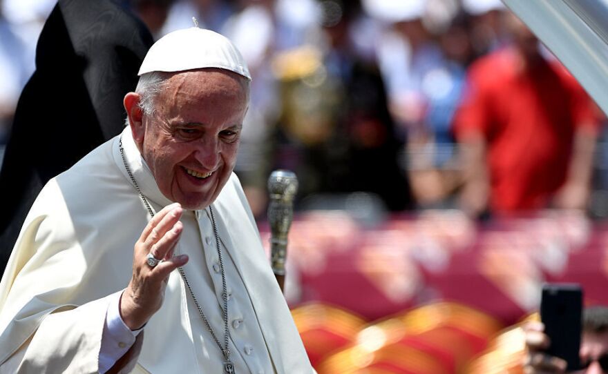 Pope Francis waves to the crowd from the popemobile after an open-air mass in Armenia's second-largest city of Gyumri on Saturday.