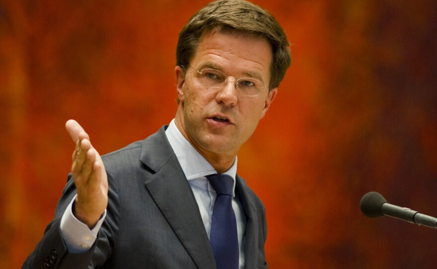 Dutch Prime Minister Mark Rutte, shown here speaking in Parliament on Tuesday, resigned a day earlier over a budget crisis.