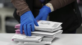 An election worker sorts mail-in ballots in Reno, Nev., on Nov. 5, 2024.