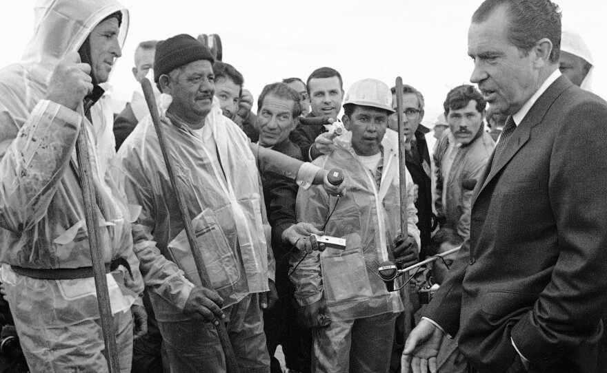 President Richard Nixon talked with workers cleaning up the oily beach at Santa Barbara in March 1969.