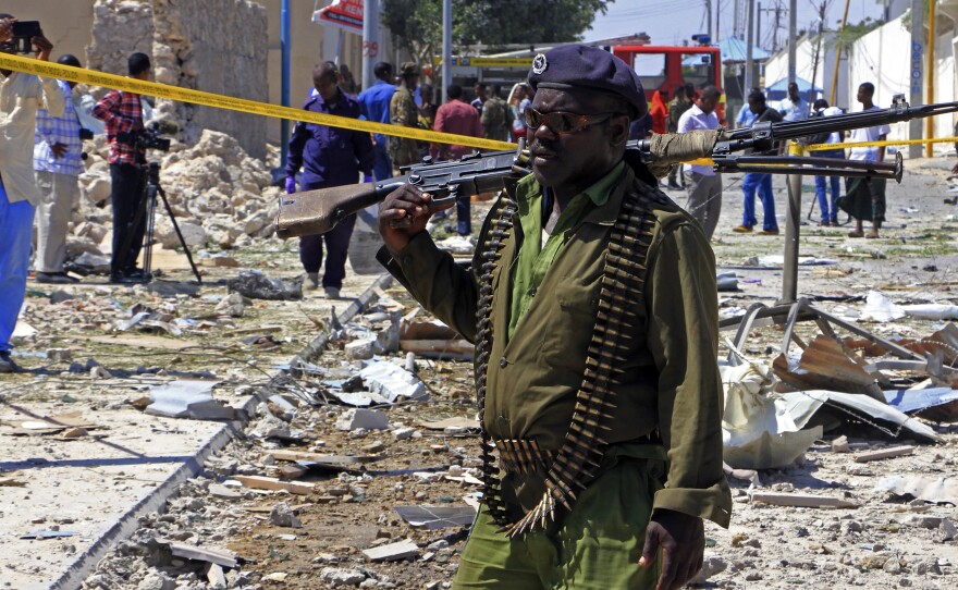 A Somali soldier patrols the area of a suicide car bomb attack in Mogadishu, Somalia, in 2017. The U.S. has been concerned for years about the military's ability to battle al-Qaida-linked militants in the country.