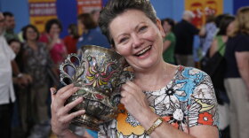 At ANTIQUES ROADSHOW in Madison, Wisconsin, this guest brings in what she calls an “ugly” piece of silver with enamel and turquoise decoration, only to learn it was made by Tiffany for the Columbian Exposition of 1893. Appraiser Ron Bourgeault deems the piece “spectacular” and assigns it a value of $50,000 to $100,000.