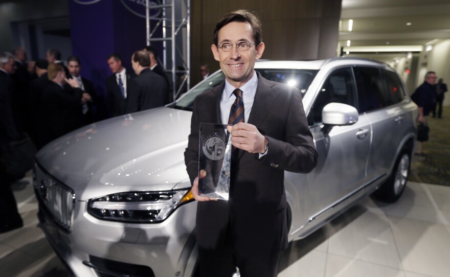 Lex Kerssemakers, CEO of Volvo North America, stands next to the Volvo XC90 after the model was named the truck/utility of the year at the North American International Auto Show, Jan. 11 in Detroit.