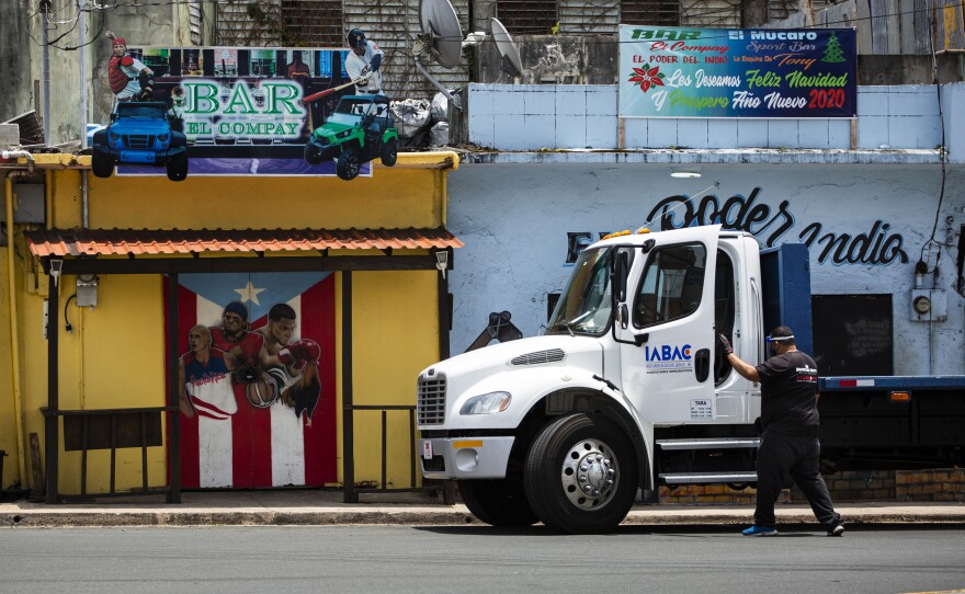 A worker in Vega Alta, P.R. In March, the island's governor imposed strict lockdown measures to control the COVID-19 outbreak.