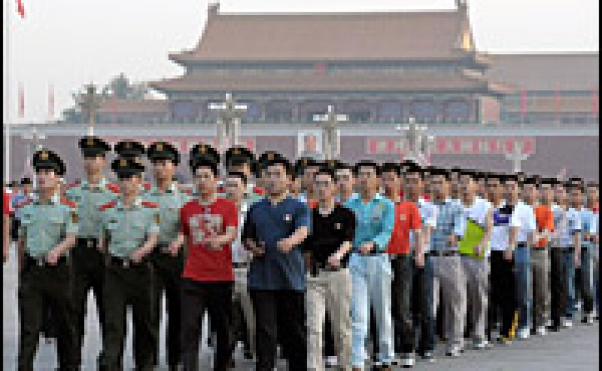 Armed police — both uniformed and plainclothes — keep strict watch in Beijing's Tiananmen Square on Thursday, the 20th anniversary of the bloody crackdown in 1989 on democracy protesters in the square.