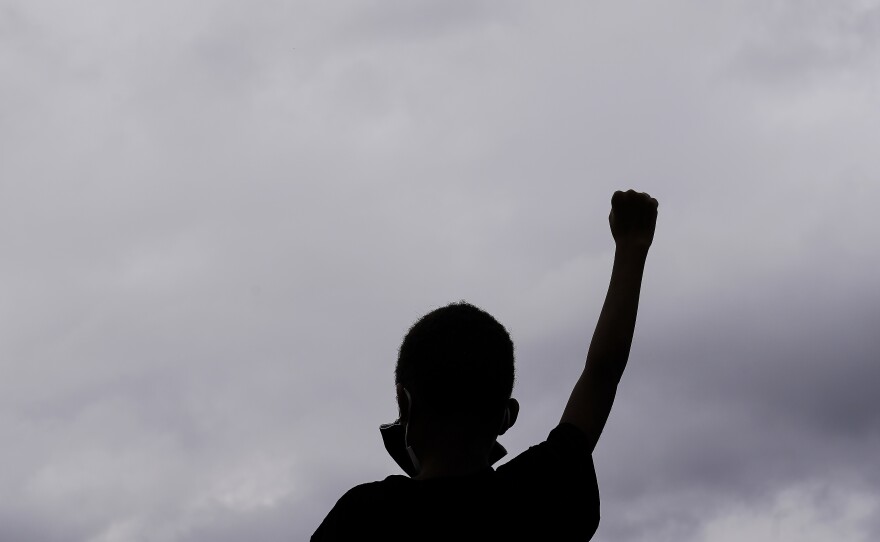ATLANTA: Christian Joseph, 9, raises his fist as he celebrates the presidential election results on Saturday, Nov. 7, 2020, in Atlanta.
