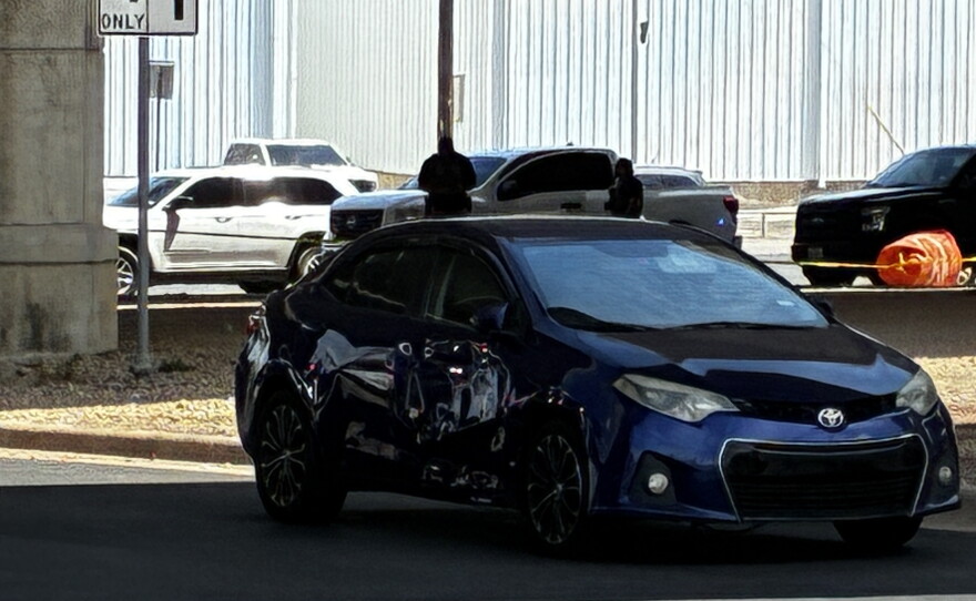 Bullet holes can be seen in a car in Austin, Texas, on Sunday.