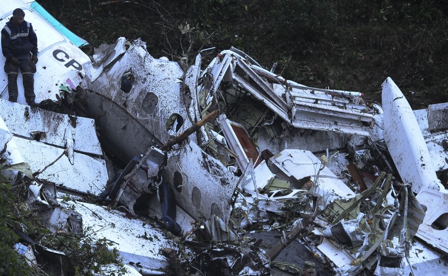 Rescue teams work on Tuesday to recover bodies from the wreckage of the LaMia charter plane that crashed in the mountains in Colombia late Monday, killing 71 people, officials say.