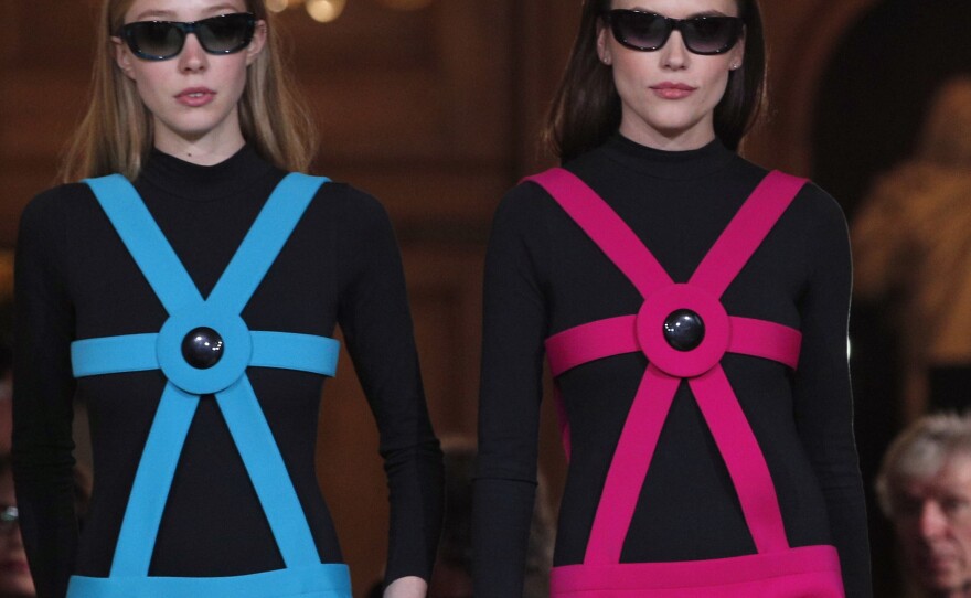 Models wear creations during a show to mark 70 years of creation by French fashion designer Pierre Cardin, in Paris in 2016.
