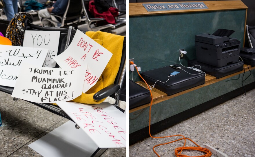 Handmade signs and temporary workstations are sprinkled throughout the international arrivals gate at Washington Dulles International Airport in D.C.