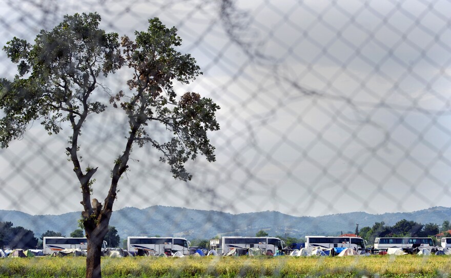 A picture taken from the Macedonian side of the border shows the evacuation of the camp near the Greek village of Idomeni. Many of the migrants and refugees were bused to camps farther south.