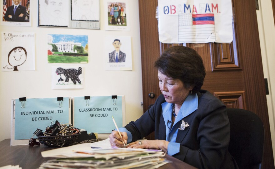Patty Shinseki, a volunteer in the Office of Presidential Correspondence, reads letters from children to President Obama in the kids mailroom in the Eisenhower Executive Office Building in Washington, D.C.