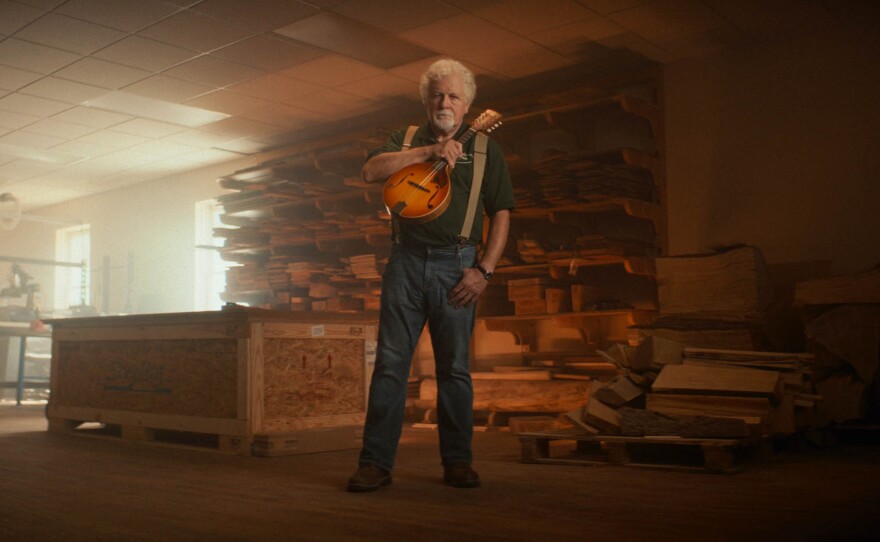 Doug Naselroad poses with one of this handmade Dulciers.