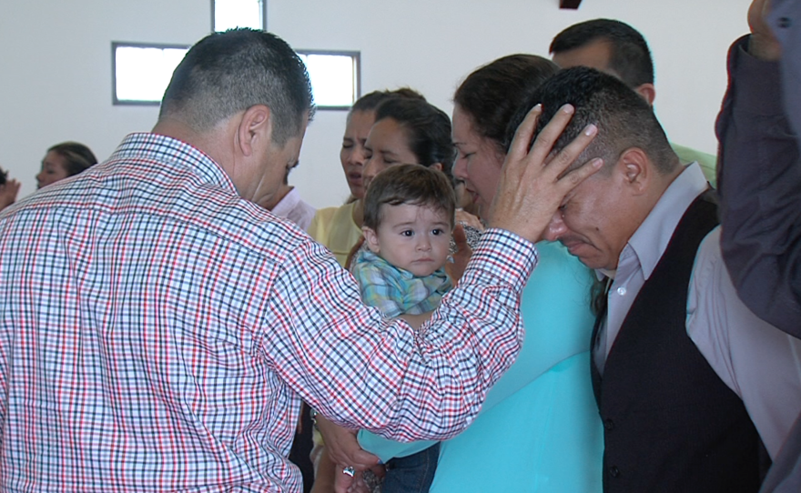 Enrique Cervantes blesses a weeping National City resident, June 14, 2015.