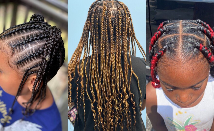 Three girls pose for photos after getting their hair braided by Brittany Starks and other volunteers.