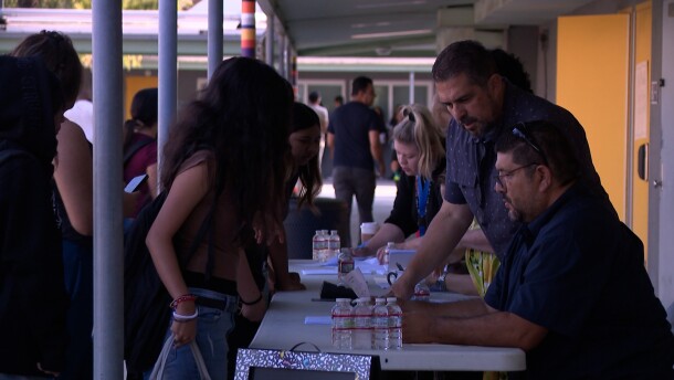 Bell Middle School students pick up their class schedules on the first day of school on Monday, Aug. 11, 2025.