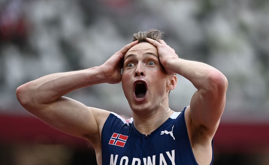 Norway's Karsten Warholm reacts after winning and breaking the world record in the men's 400m hurdles final on August 3.