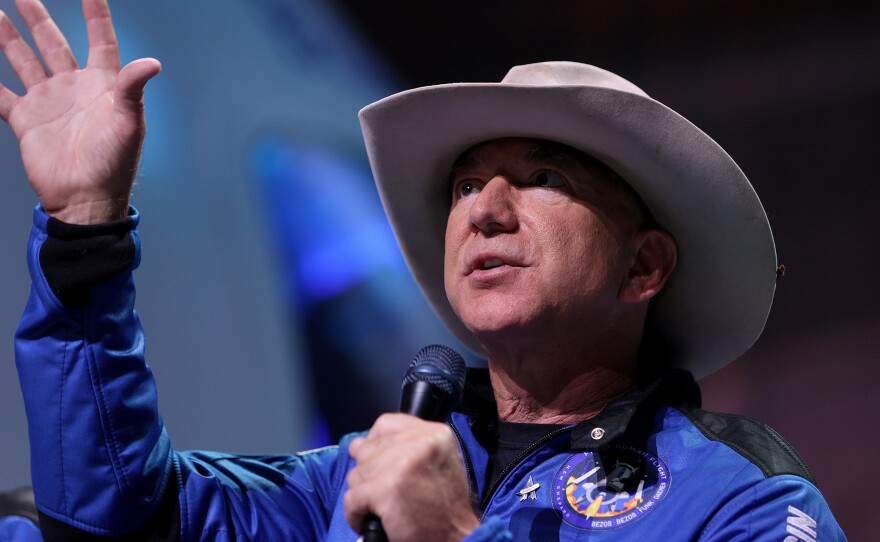 Jeff Bezos speaks about his brief space flight on Blue Origin's New Shepard during a news conference on July 20, in Van Horn, Texas. Blue Origin is suing NASA over a lunar lander contract awarded to rival SpaceX.