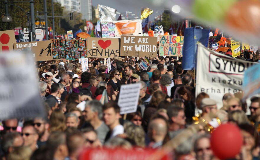 Demonstrators march Saturday in a massive protest against racism in Berlin.